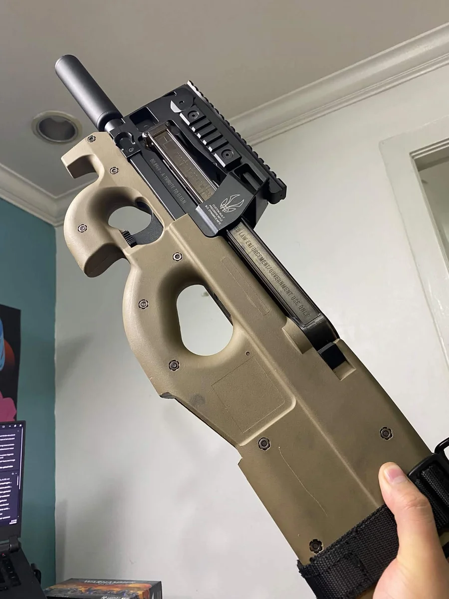 King Arms FN P90 AEG (M3) held upright in stock configuration with a lightweight suppressor