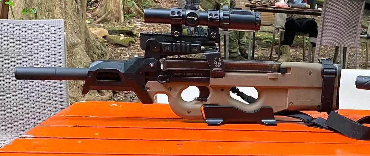 King Arms FN P90 AEG (M3) with a 3D-printed long DMR-style upper, scope and suppressor at an airsoft field